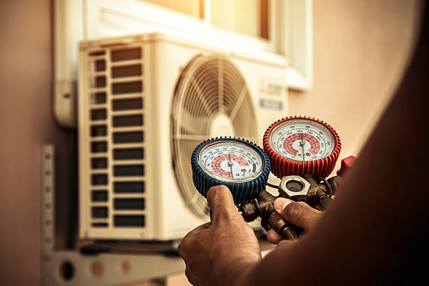 Professional Heat Pump Repair technician working in Redkey, IN